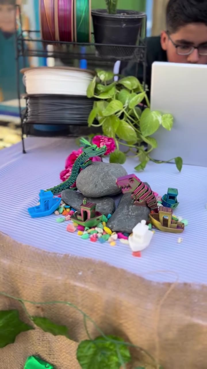 Colourful 3D printed dragons and boats on display at the H3D Printing booth