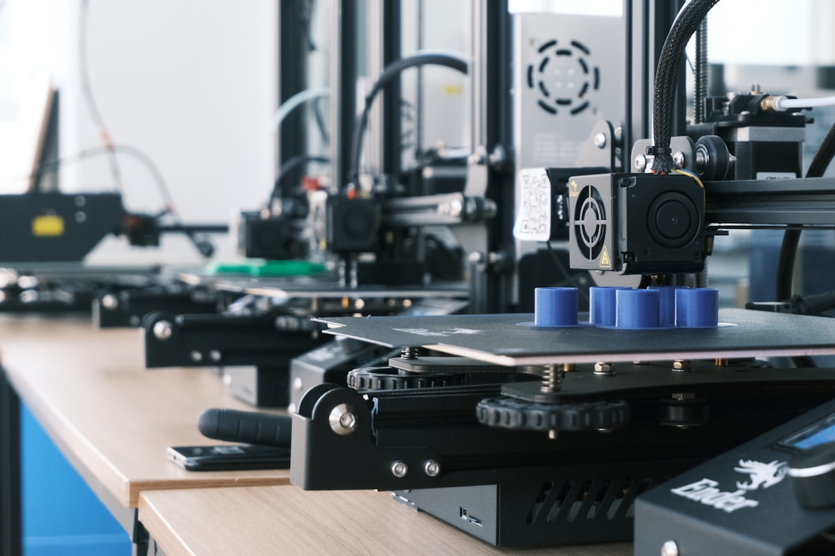 Row of 3D printers building models